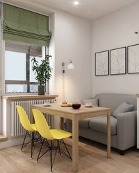 Interior of a rectangular kitchen with a sofa photo