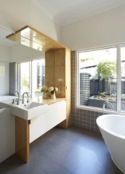 Bathroom design with a window in a country house
