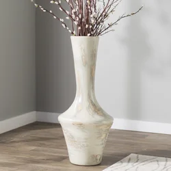Floor vase with flowers in the interior of the living room