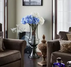 Floor vase with flowers in the interior of the living room