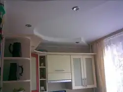 Photo of two-level plasterboard ceilings in the kitchen with lighting