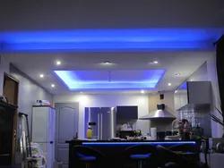 Photo of two-level plasterboard ceilings in the kitchen with lighting
