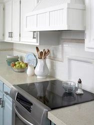 Apron for the kitchen in the interior of a white kitchen