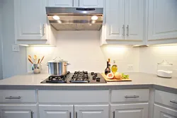 Apron for the kitchen in the interior of a white kitchen