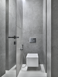 Bathroom design with shower in gray tones