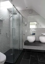 Bathroom design with shower in gray tones