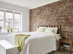 Brick wall in the bedroom interior