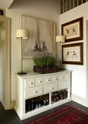 Hallway interior with chest of drawers and mirror