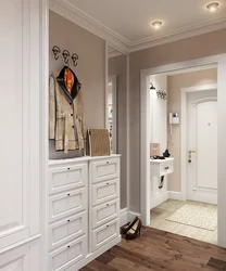 Hallway interior with chest of drawers and mirror