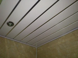 Step-by-step photo of a bathroom ceiling made of plastic panels