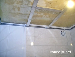 Step-by-step photo of a bathroom ceiling made of plastic panels