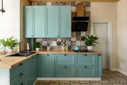 Green kitchen with blue photo