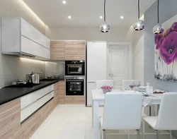 Interior of a corner kitchen in a modern style in light colors