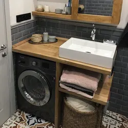 Install a washing machine in the bathroom under the sink photo