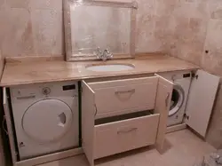 Install a washing machine in the bathroom under the sink photo