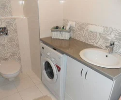 Bath Interior With Washing Machine And Countertop