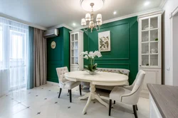 Emerald sofa in the interior of the kitchen living room