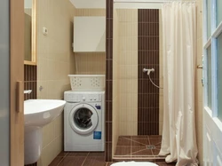 Bathroom interior with shower and toilet, washing machine