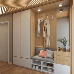 Design of a narrow hallway with a wardrobe in a modern style