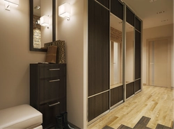 Design of a narrow hallway with a wardrobe in a modern style