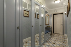 Design of a narrow hallway with a wardrobe in a modern style