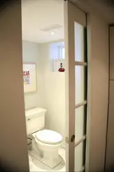 Photo of doors in a small bath