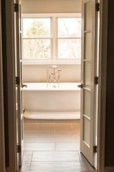 Photo Of Doors In A Small Bath