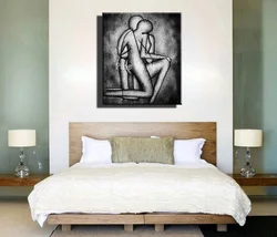 What kind of paintings hang in the bedroom photo