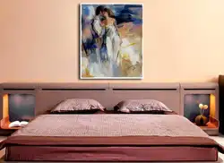 What kind of paintings hang in the bedroom photo