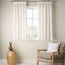 Short curtains for the bedroom up to the windowsill in a modern style photo