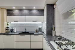 Light gray kitchen with dark countertop photo