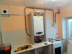 Gas boiler in the kitchen at home photo