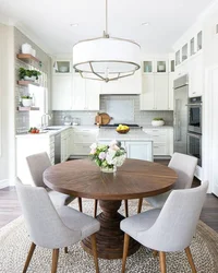 Round Table In The Interior Of A Small Kitchen