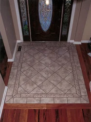Tiles At The Entrance Door In The Hallway And Laminate Photo