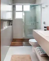 Narrow bathroom design with window
