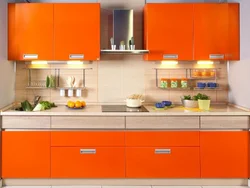 Orange kitchen set in the kitchen interior