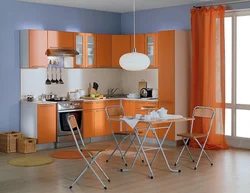 Orange kitchen set in the kitchen interior