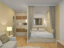 Interior of a room in a one-room apartment with a bed photo