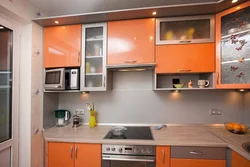 Orange kitchen in the interior with what color