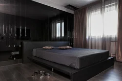 Bedroom interior with dark colored furniture