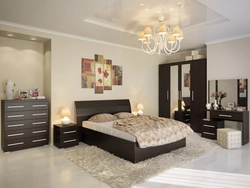 Bedroom interior with dark colored furniture