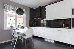 Kitchen with white furniture and gray wallpaper photo