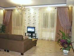 Living room two windows on one wall with a wall photo