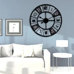 Large wall clock in the living room in the interior photo