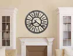 Large wall clock in the living room in the interior photo