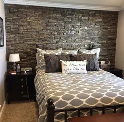 Bedroom interior with stone on the wall