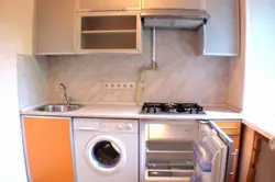 Kitchen design in Khrushchev with a gas water heater and a washing refrigerator