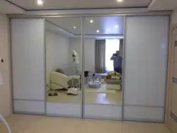 Photo Of A Wardrobe In The Bedroom With A Mirror For Three Doors
