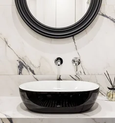 Black sink in the bathroom interior