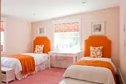 Orange wallpaper in the bedroom interior